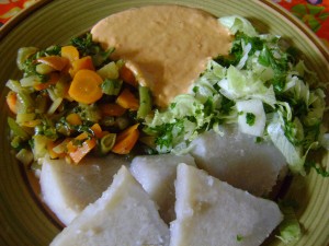 Vegetable stir-fry with dasheen, salad and peanut sauce