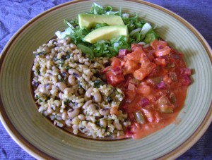 Brown rice and peas with curry vegetables and salad