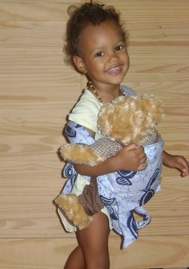 keeyah-baby-carrier Keeyah with her own Mei Tai baby carrier! Made by Caribbean Apparels, 9 King George V St, Roseau, Tel :448 0118 (cute child and teddy bear not included!)