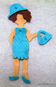 blue clothes close up felt doll