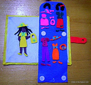 yellow felt doll with wardrobe